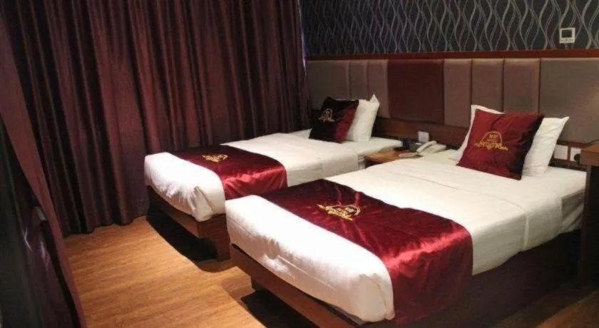 Bed in Metro Winner Hotel