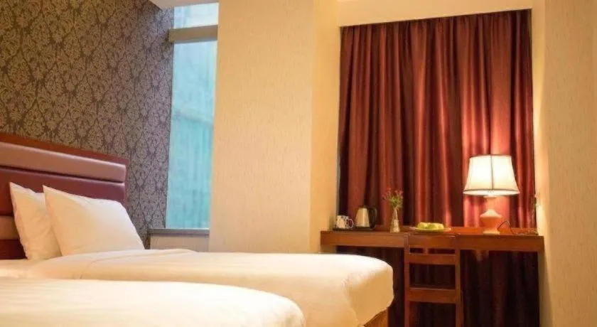 Bed in Metro Winner Hotel