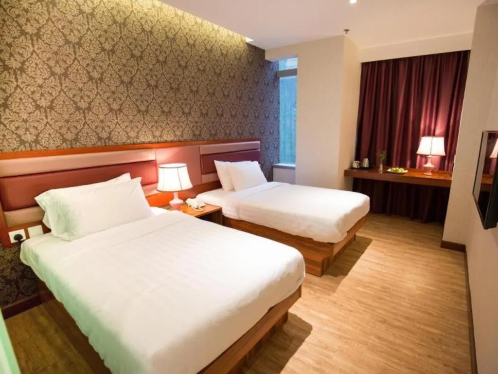 Bed in Metro Winner Hotel