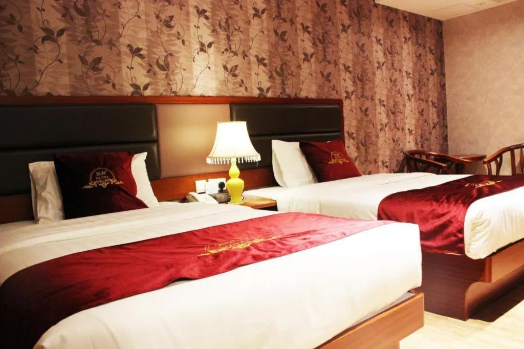 Bed in Metro Winner Hotel