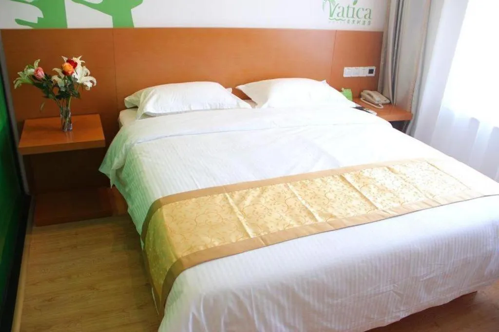 Bed in Vatica Tianjin Jinghai Bus Station Home World Plaza Hotel