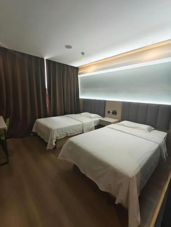 Bed in Vatica Tianjin Jinghai Bus Station Home World Plaza Hotel