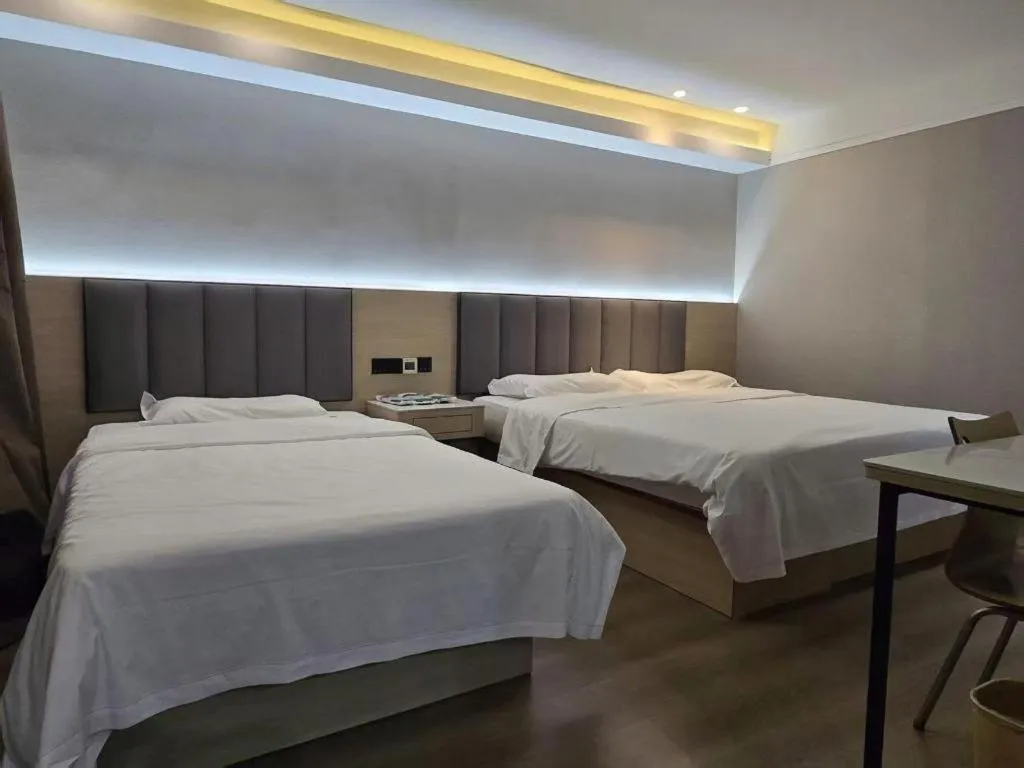 Bed in Vatica Tianjin Jinghai Bus Station Home World Plaza Hotel