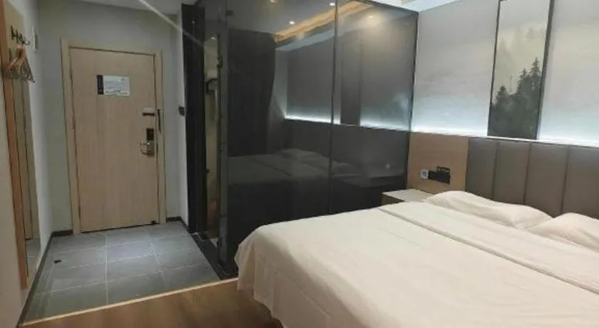 Bed in Vatica Tianjin Jinghai Bus Station Home World Plaza Hotel