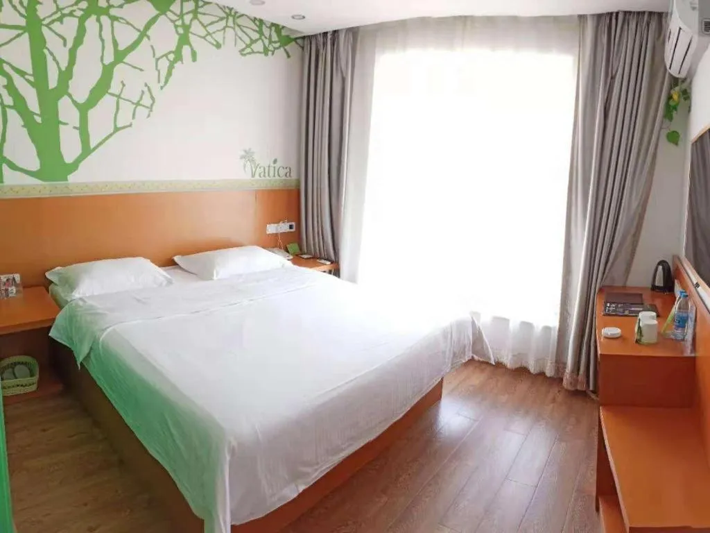 Bed in Vatica Tianjin Jinghai Bus Station Home World Plaza Hotel