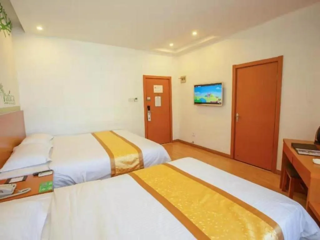 Bed in Vatica Tianjin Jinghai Bus Station Home World Plaza Hotel