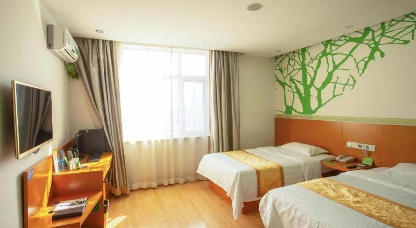 Bed in Vatica Tianjin Jinghai Bus Station Home World Plaza Hotel