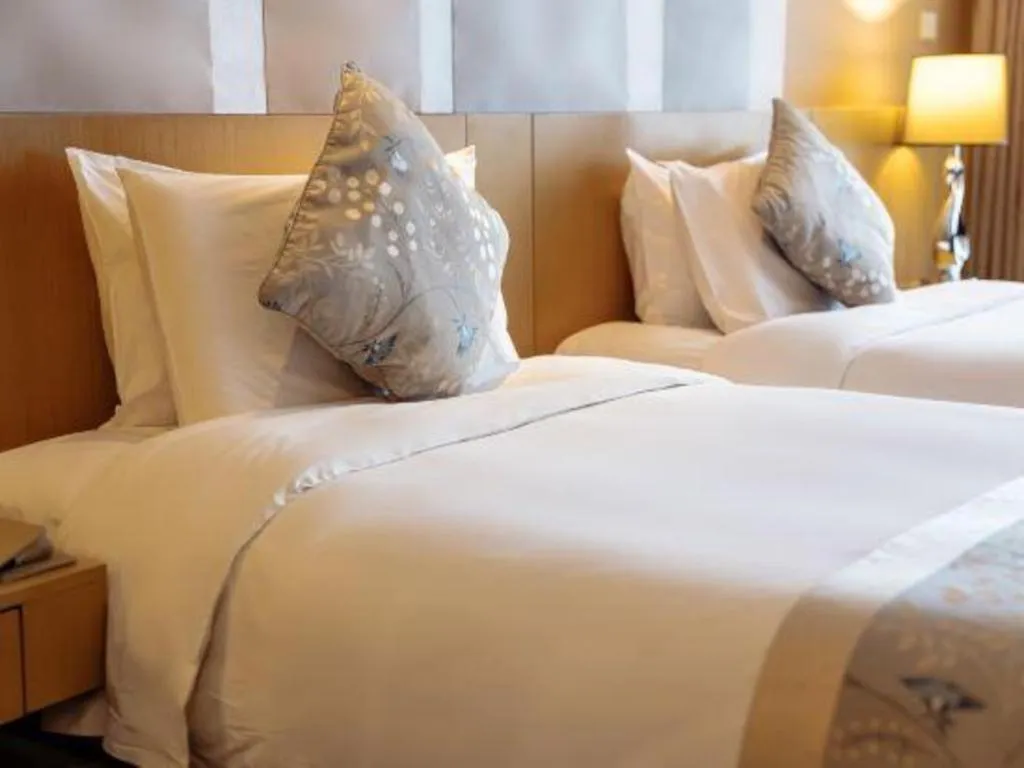 Bed in CITIC Jinling Hotel