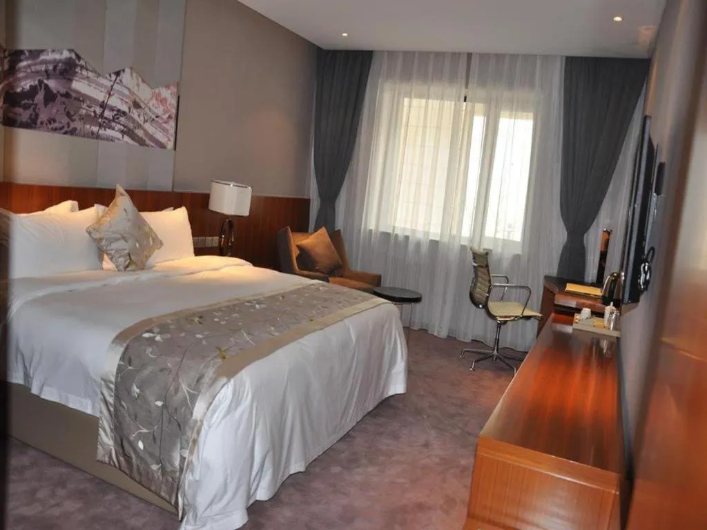 Bed in CITIC Jinling Hotel