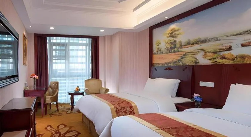 Bed in Vienna Hotel Shenzhen Exhibition Center Gangxia Metro Station