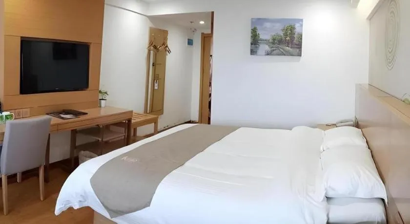 Bed in GreenTree Inn Anqing Qianshan County Sunshine City Express Hotel
