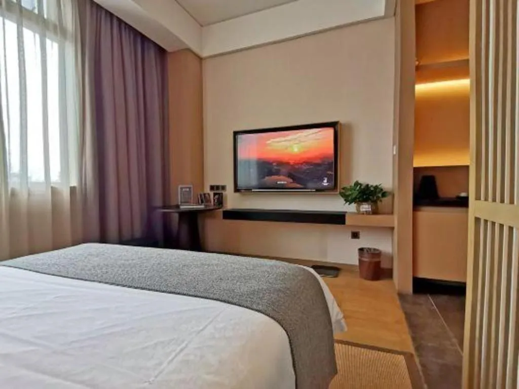 Bed in Jolie Vue Boutique Hotel Sanjiang
