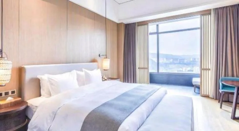 Bed in Jolie Vue Boutique Hotel Sanjiang