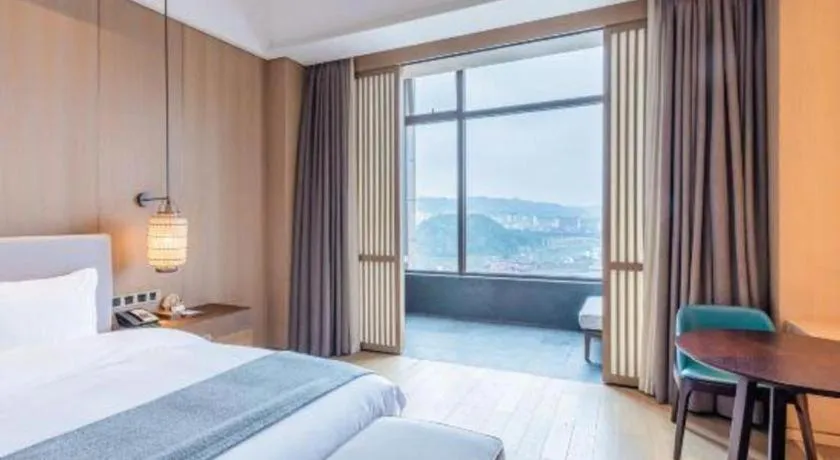 Bed in Jolie Vue Boutique Hotel Sanjiang