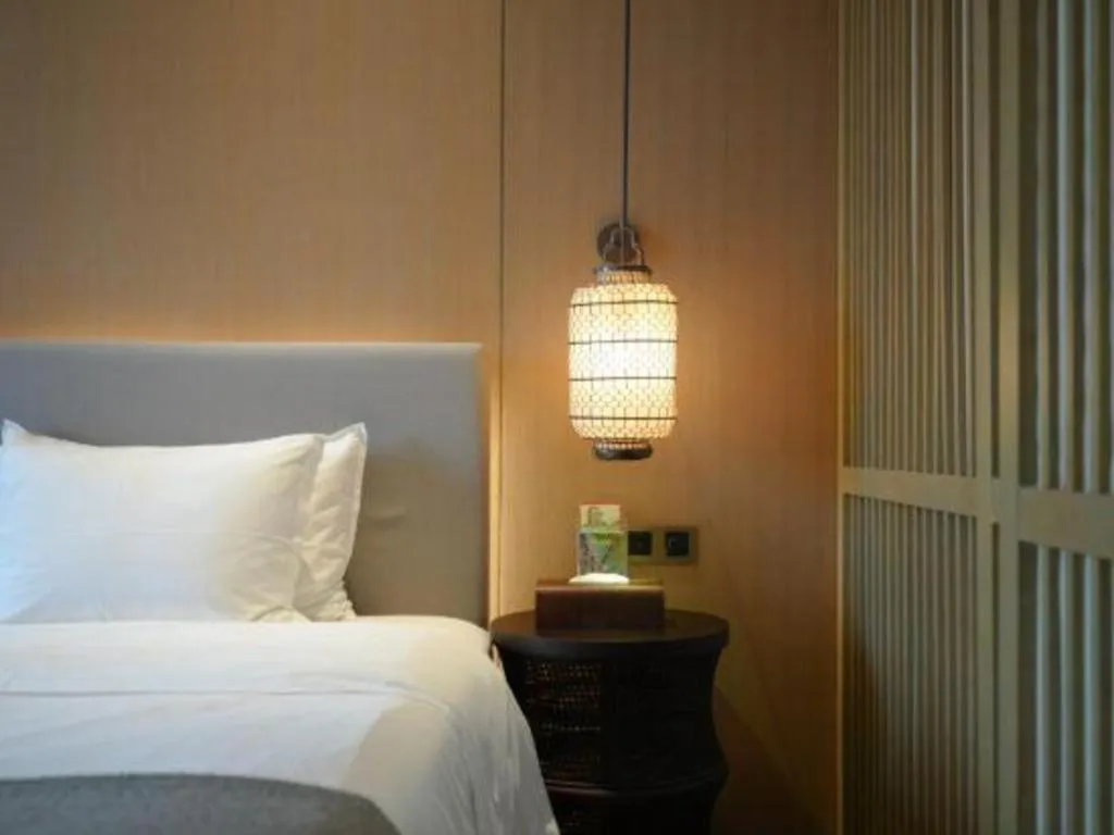 Bed in Jolie Vue Boutique Hotel Sanjiang