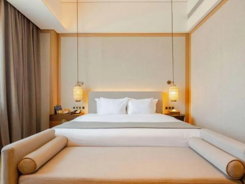 Bed in Jolie Vue Boutique Hotel Sanjiang