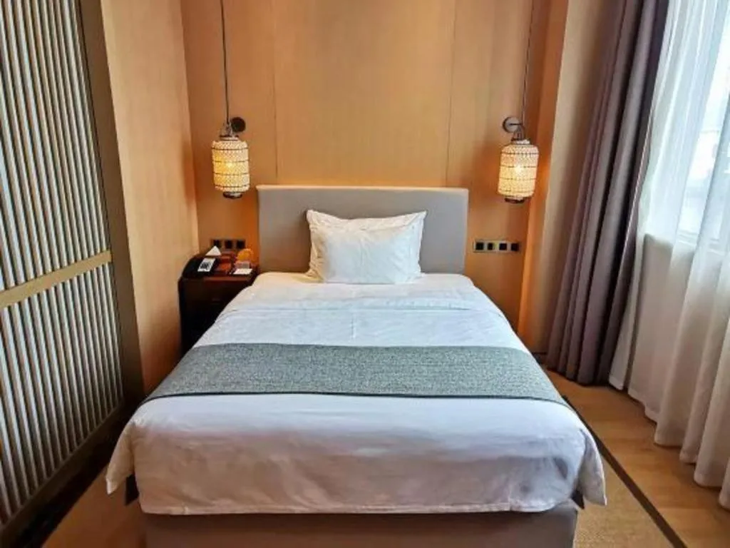 Bed in Jolie Vue Boutique Hotel Sanjiang