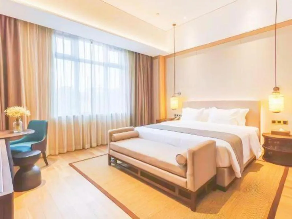 Bed in Jolie Vue Boutique Hotel Sanjiang