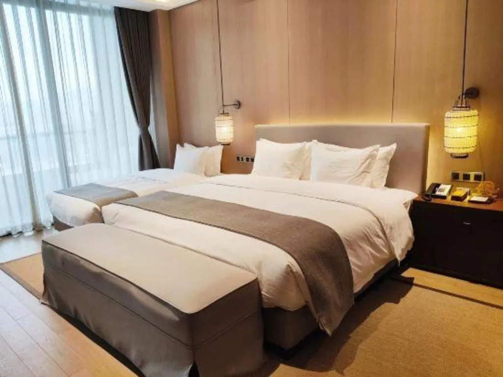 Bed in Jolie Vue Boutique Hotel Sanjiang