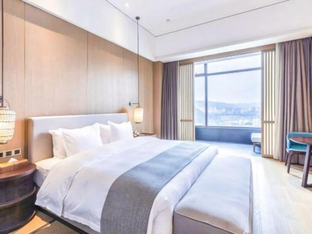 Bed in Jolie Vue Boutique Hotel Sanjiang
