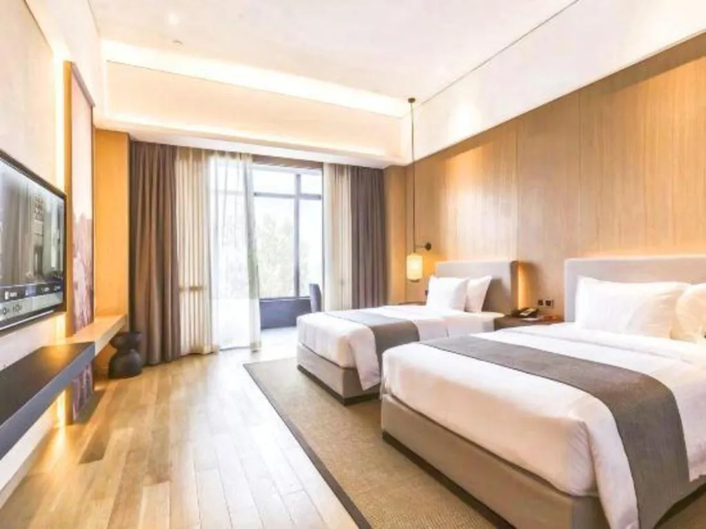 Bed in Jolie Vue Boutique Hotel Sanjiang