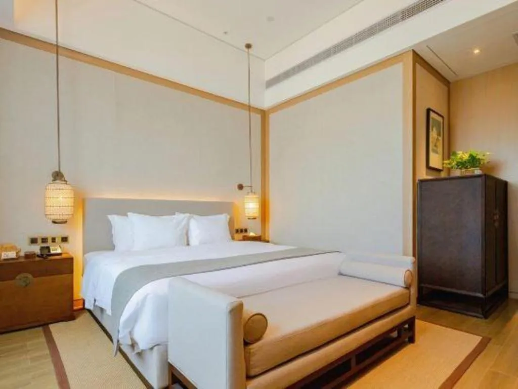 Bed in Jolie Vue Boutique Hotel Sanjiang