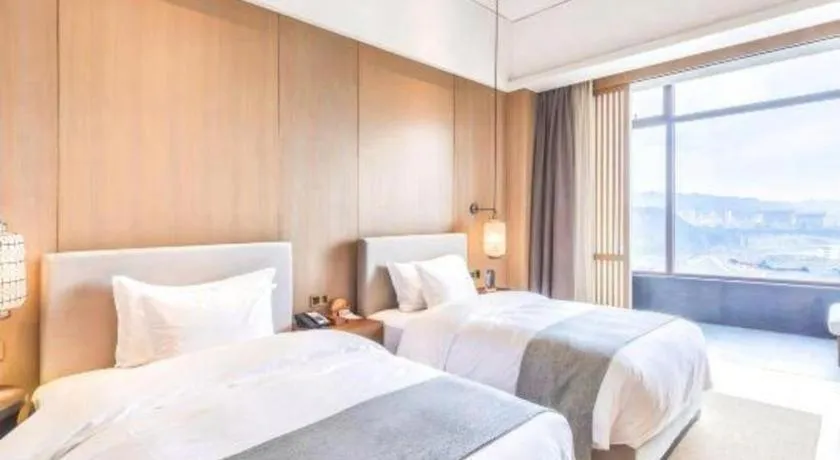 Bed in Jolie Vue Boutique Hotel Sanjiang