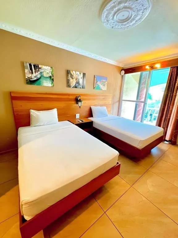 Bed in Roman Empire Panglao Boutique Resort