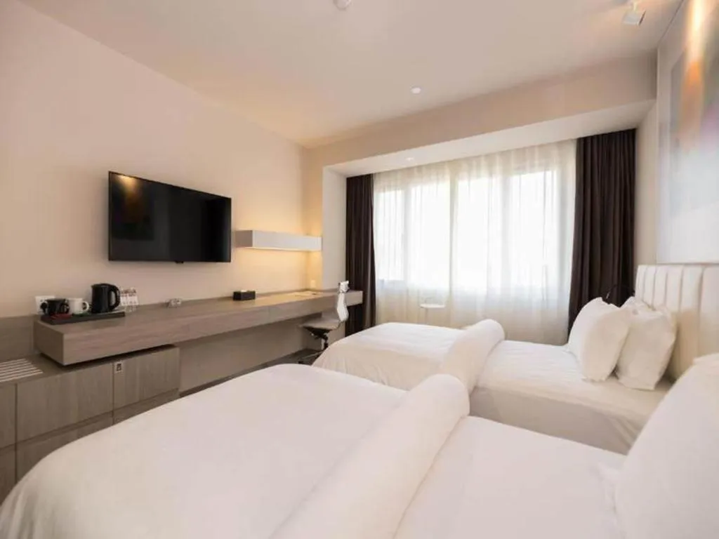 Bed in Jinjiang Metropolo Shanghai Xujiahui Nanhuating Hotel