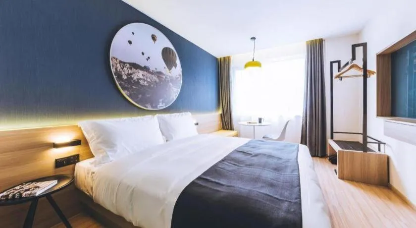 Bed in Ibis Styles Shanghai Qingpu Sports Center Hotel