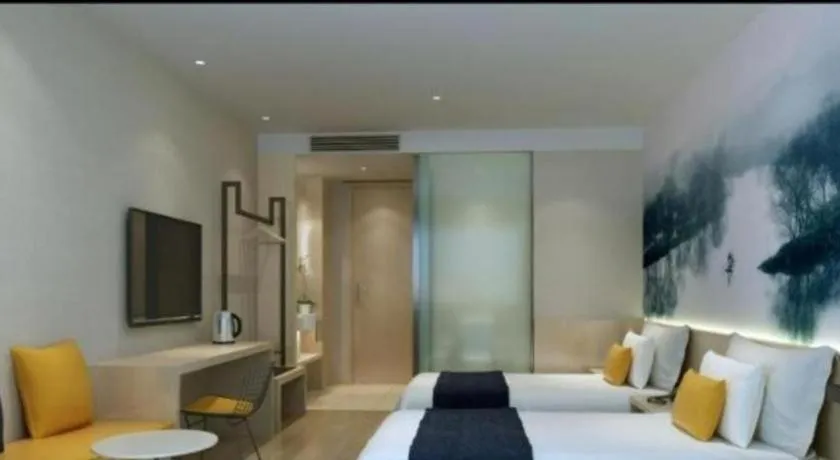 Bed in Ibis Styles Shanghai Qingpu Sports Center Hotel