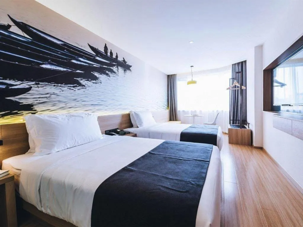 Bed in Ibis Styles Shanghai Qingpu Sports Center Hotel