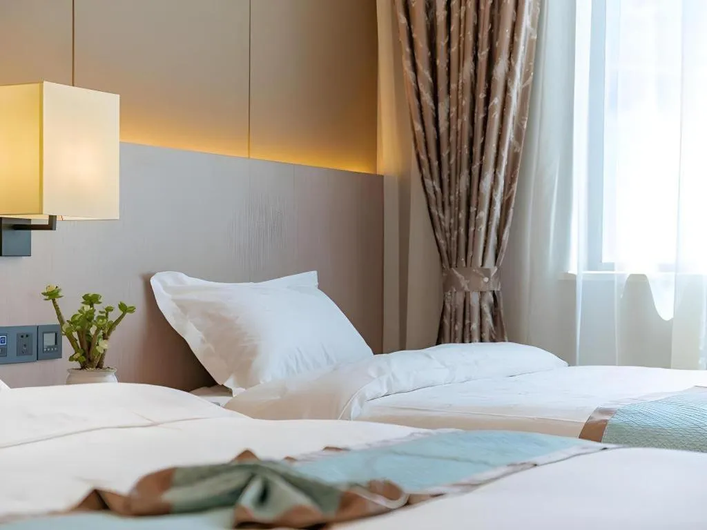 Bed in GreenTree Eastern Dali Railway Station Hotel