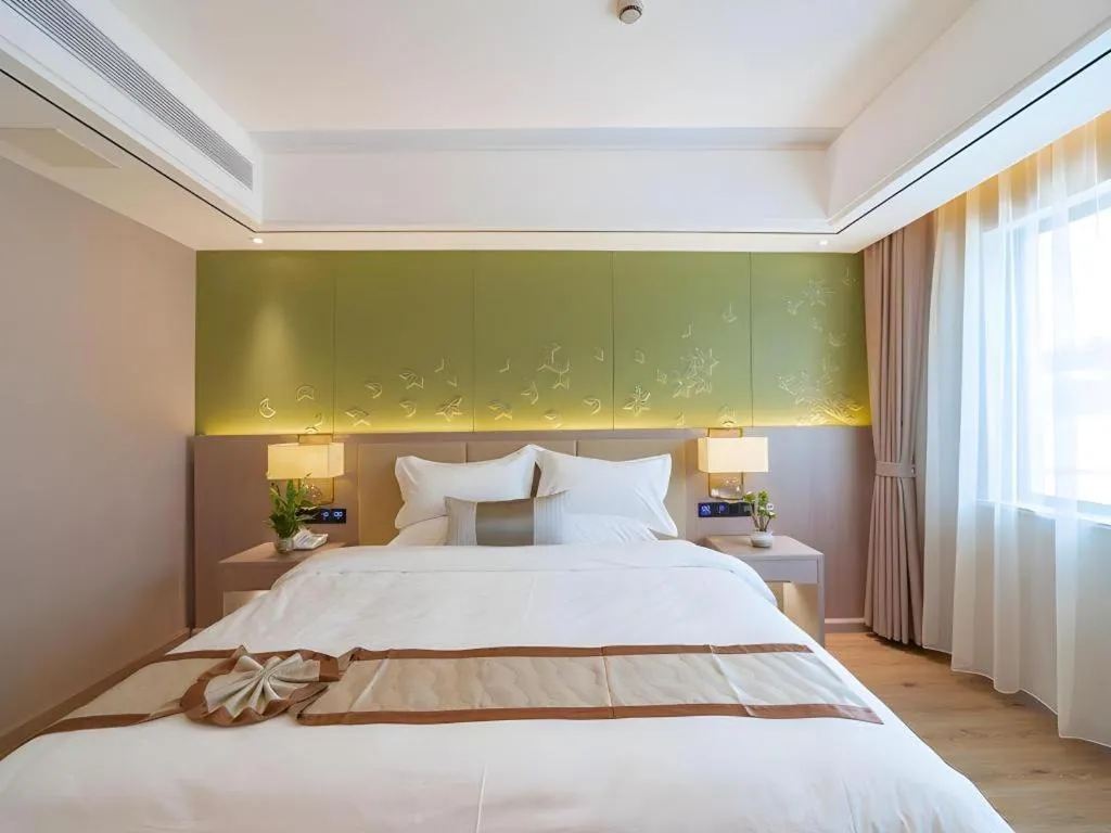 Bed in GreenTree Eastern Dali Railway Station Hotel