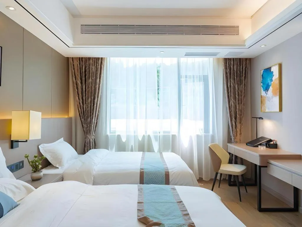 Bed in GreenTree Eastern Dali Railway Station Hotel