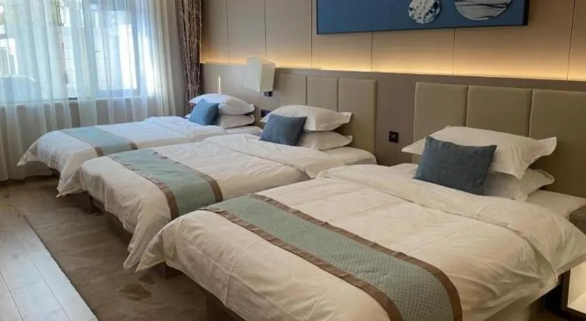 Bed in GreenTree Eastern Dali Railway Station Hotel