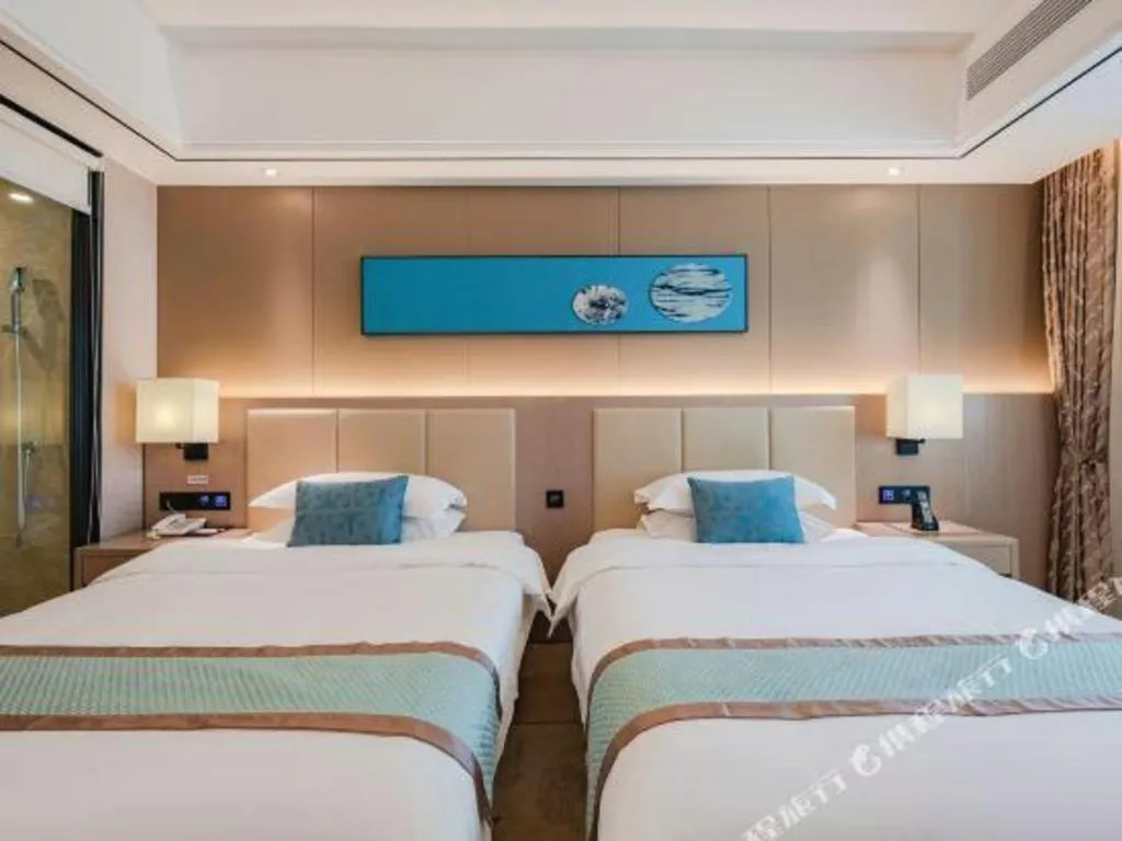 Bed in GreenTree Eastern Dali Railway Station Hotel