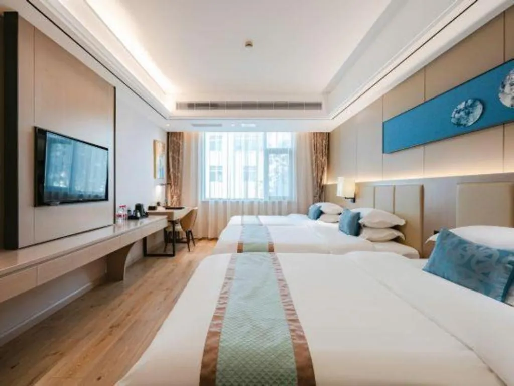 Bed in GreenTree Eastern Dali Railway Station Hotel