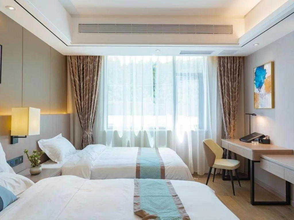 Bed in GreenTree Eastern Dali Railway Station Hotel