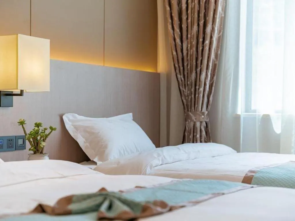 Bed in GreenTree Eastern Dali Railway Station Hotel