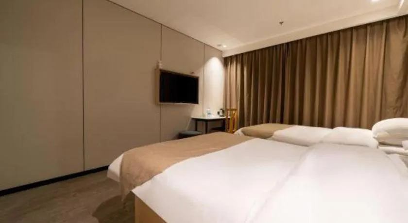 Bed in GreenTree Inn Shanghai Railway Station Macao Road