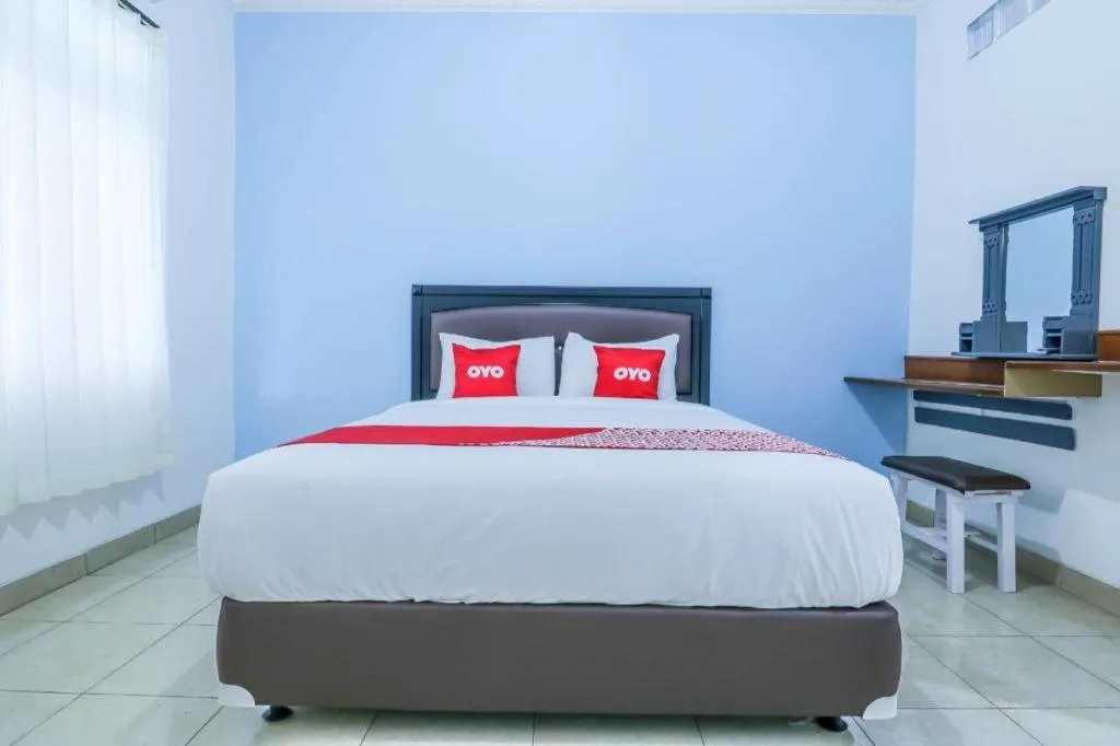 Bed in OYO 1755 De'balcon Accomodation Near Ngurah Rai Airport
