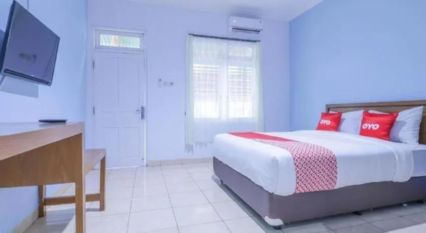Bed in OYO 1755 De'balcon Accomodation Near Ngurah Rai Airport