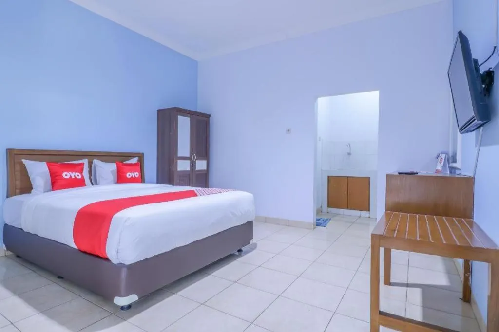 Bed in OYO 1755 De'balcon Accomodation Near Ngurah Rai Airport