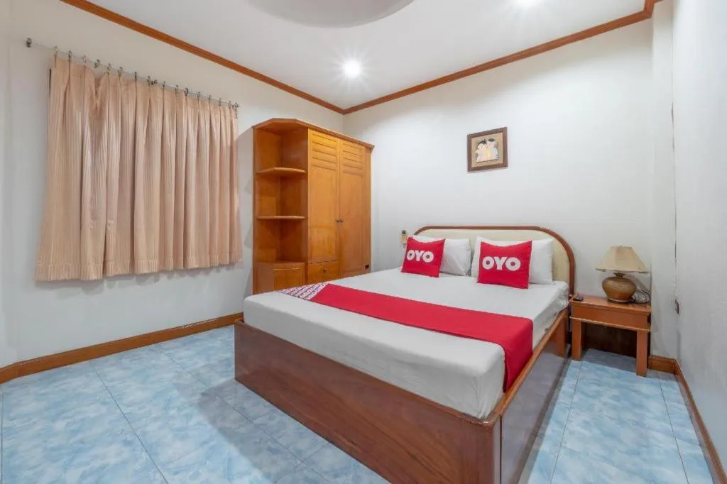 Bed in OYO 1125 Chokdee Inn