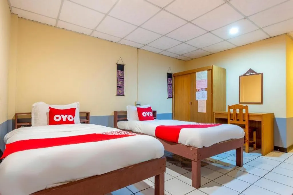 Bed in OYO 1000 Maetang Hotel