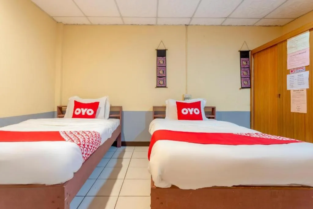 Bed in OYO 1000 Maetang Hotel