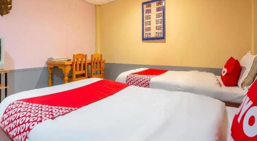 Bed in OYO 1000 Maetang Hotel