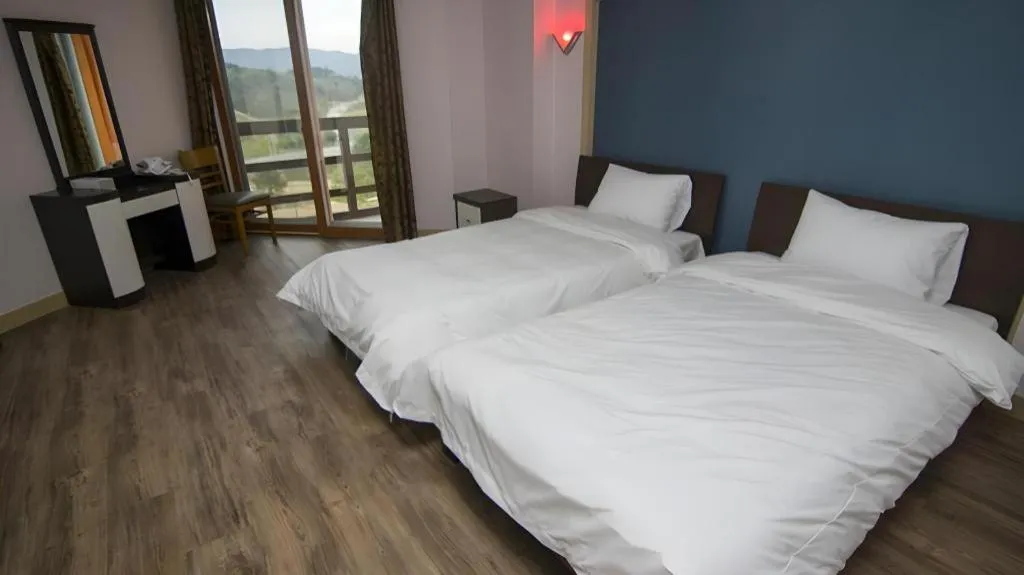 Bed in Hyundai Elliot Hotel and Resort