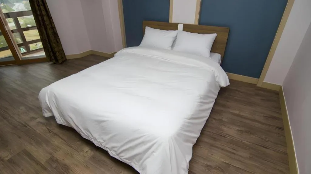 Bed in Hyundai Elliot Hotel and Resort